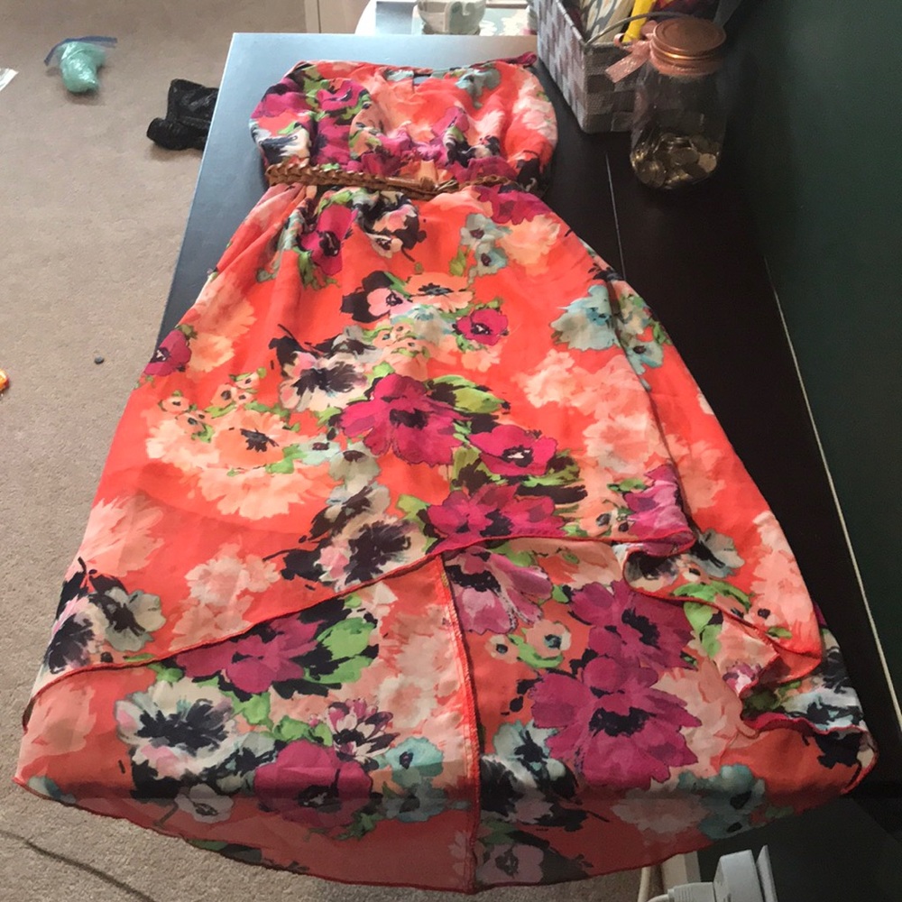 Pink dress with flower designs.